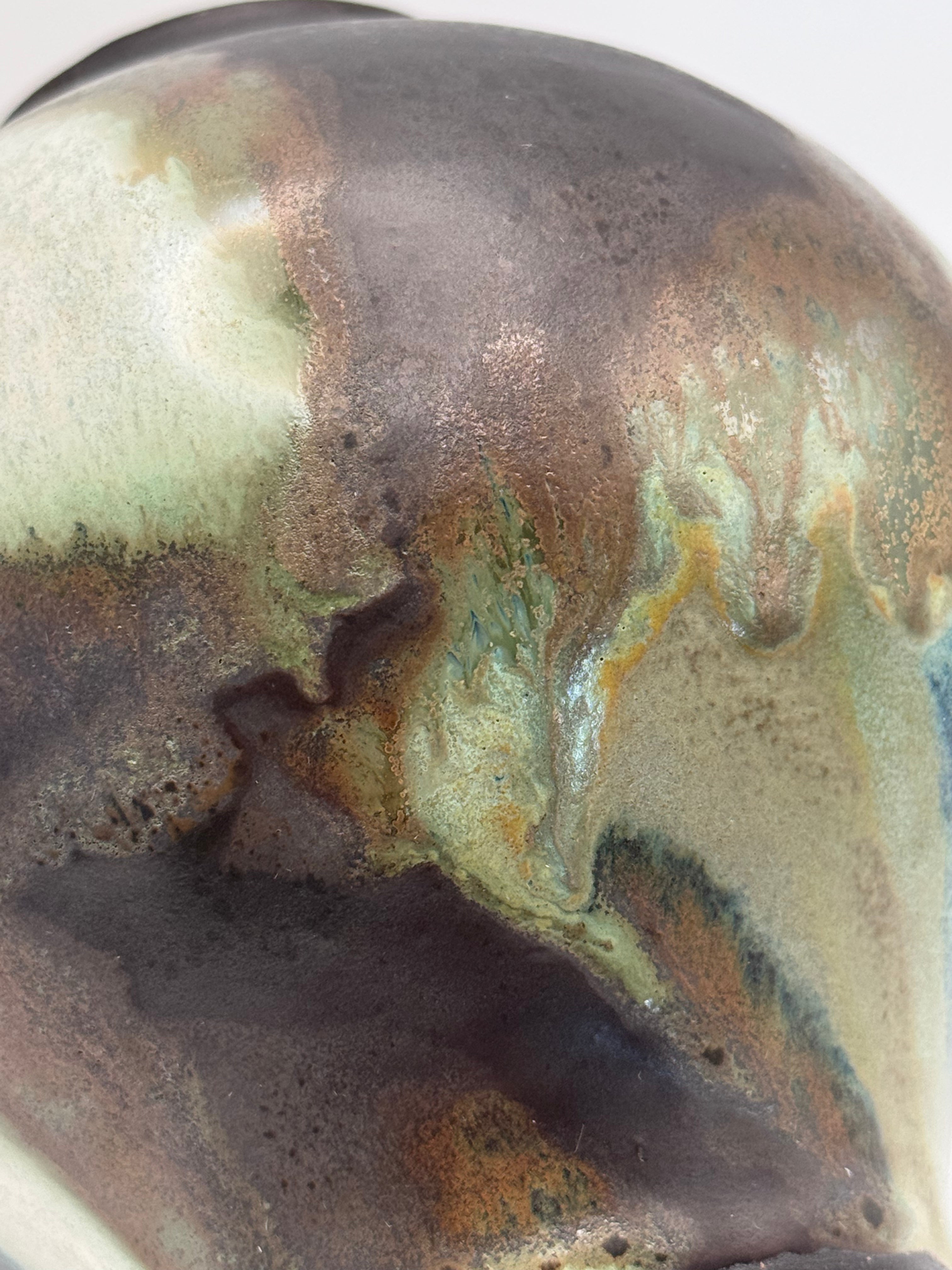 dark brown, green, and white glazed blended on a vase