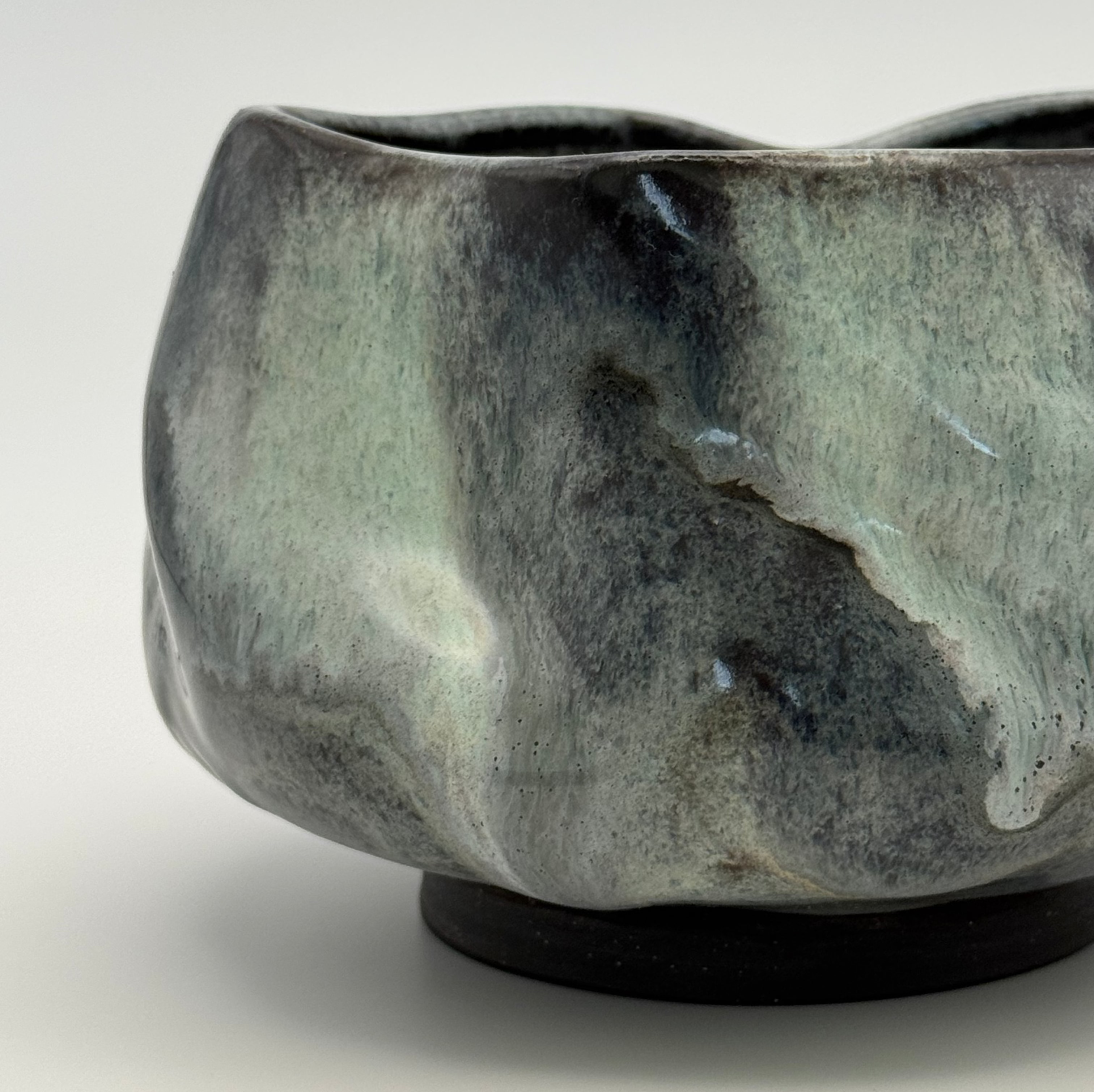 Marble-like ceramic bowl on a white background