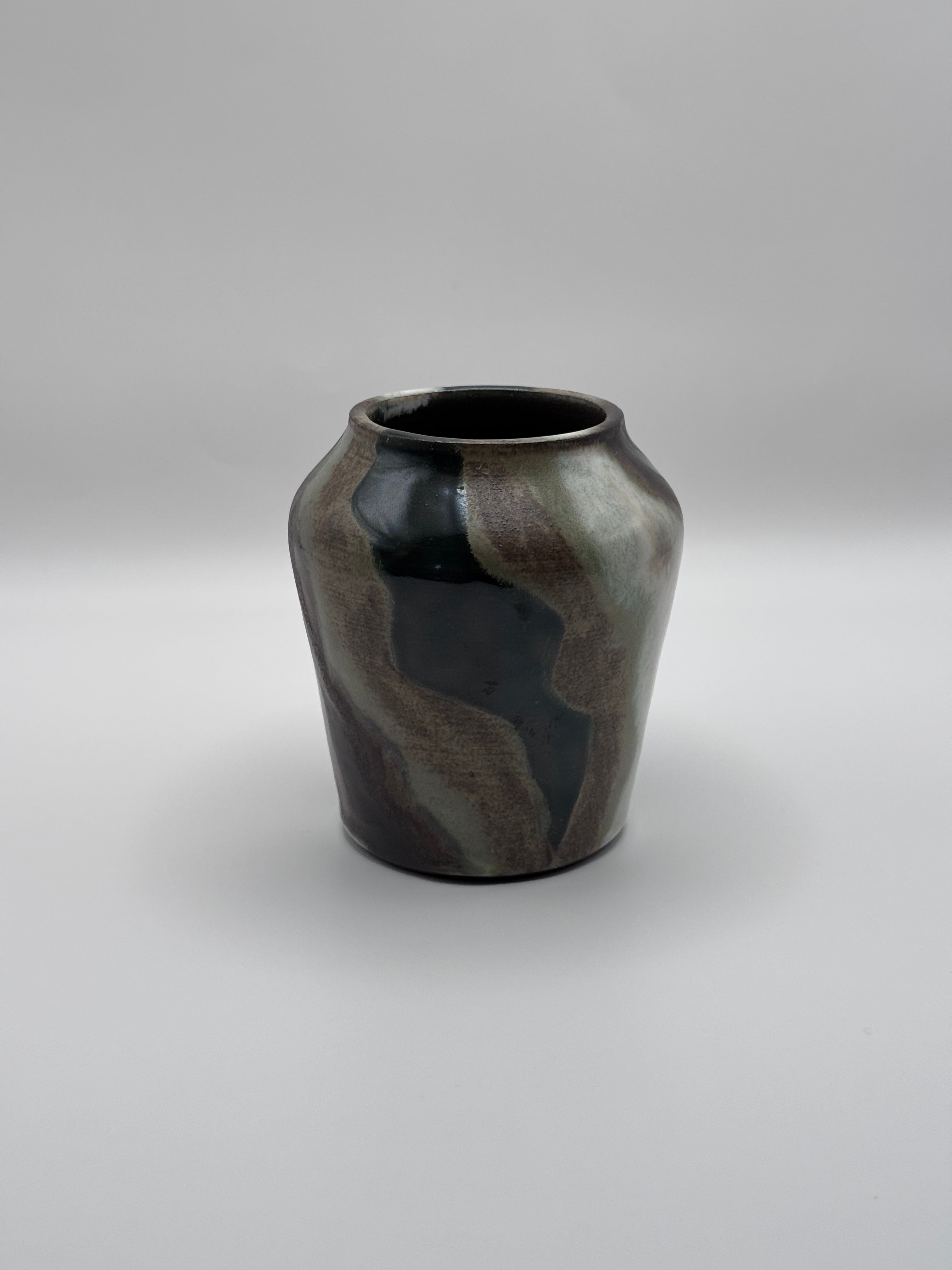 Tall ceramic vase with a defined shoulder and wide mouth, vertical streaks of dark brown, white, and green celadon glaze. View 2 of 3