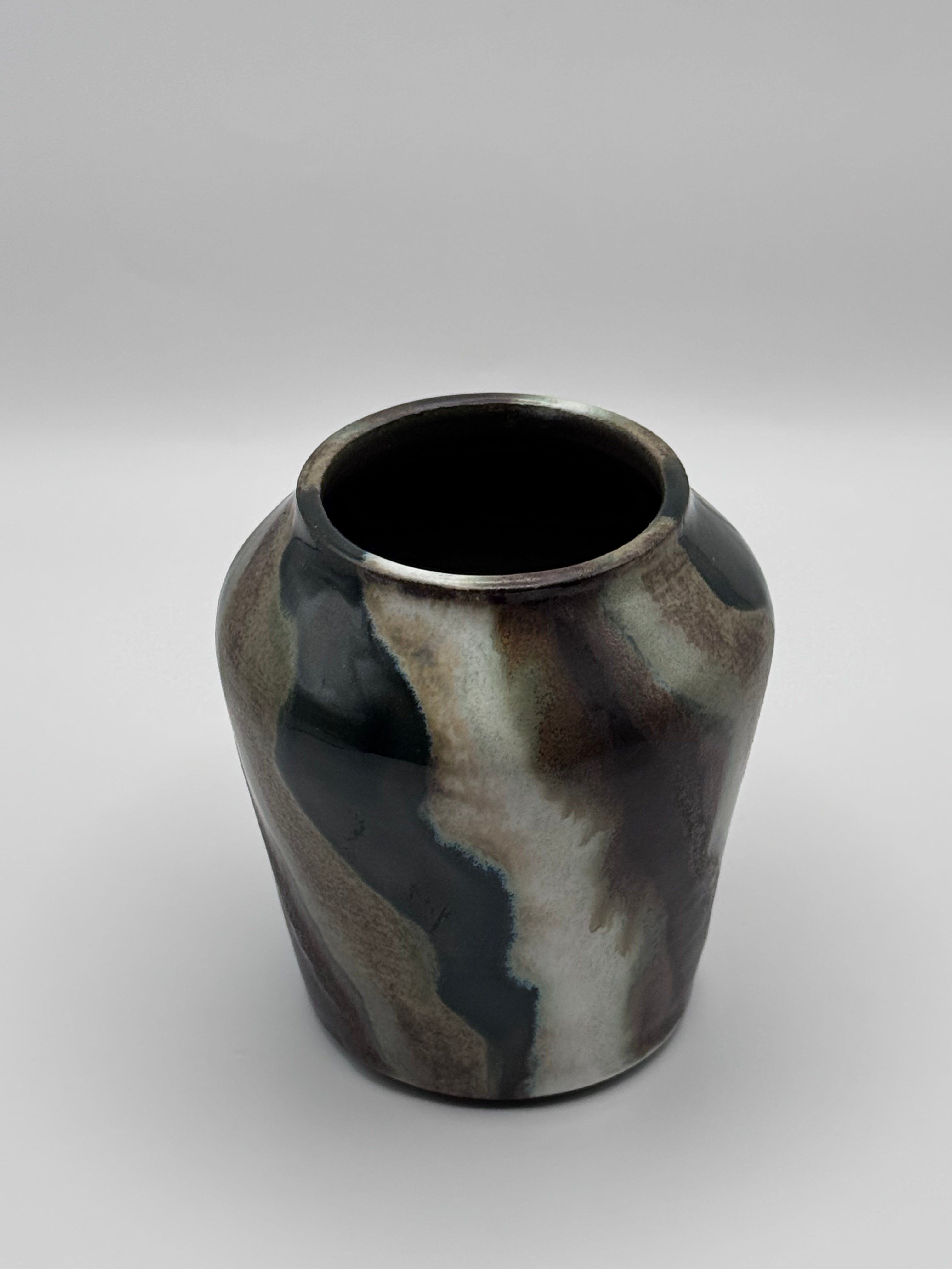 Top view of tall ceramic vase with a defined shoulder and wide mouth.
